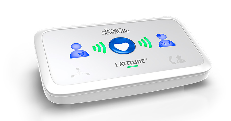 physician with a patient and LATITUDE™ NXT Home Monitoring System