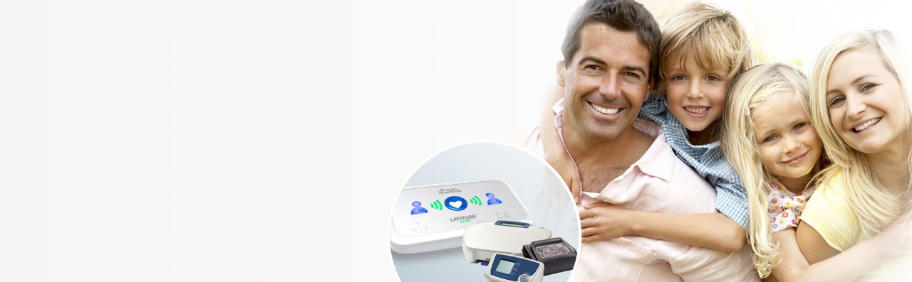 physician with a patient and LATITUDE™ NXT Home Monitoring System